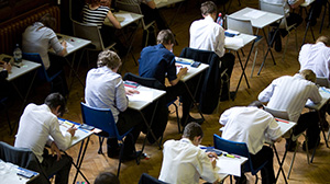 Pupils fill an exam hall to take a GCSE exam at Maidstone Grammar school in Maidstone, Kent, U.K.